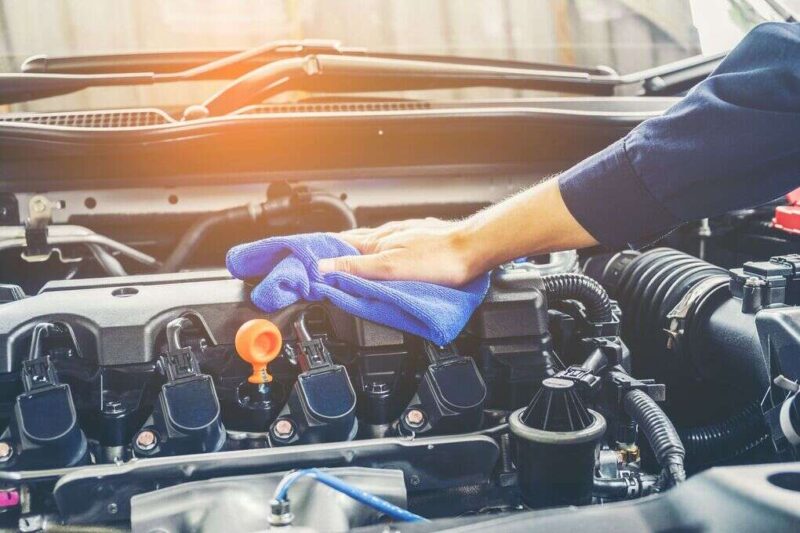 cropped of mechanic cleaning car engine royalty free image 944169048 1554929384