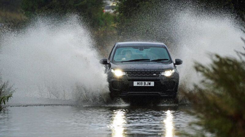 car driving through flood