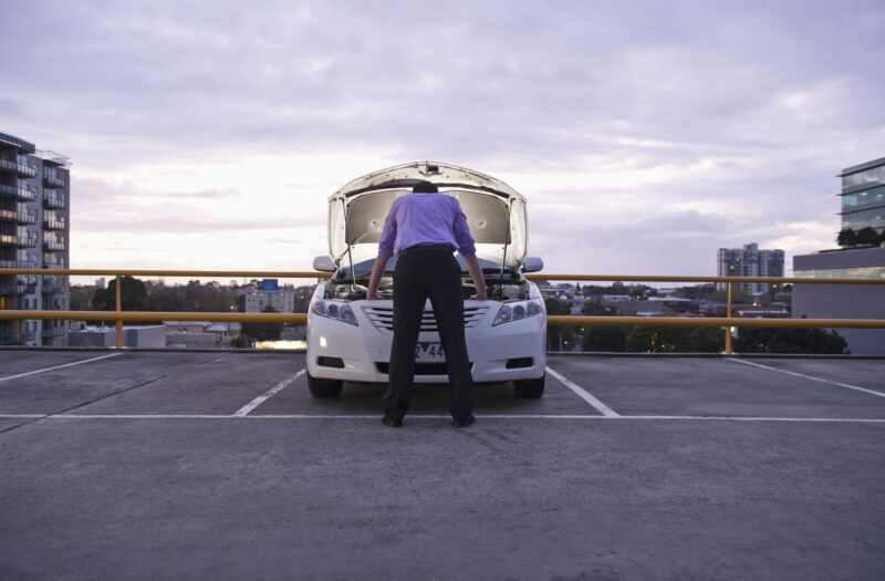 caucasian businessman checking underneath royalty free image 1589575759