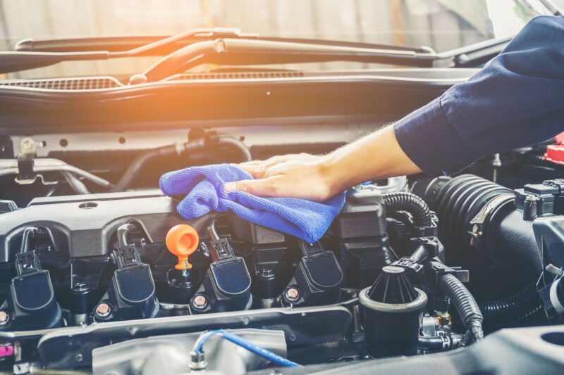 cropped of mechanic cleaning car engine royalty free image 944169048 1554929384 1