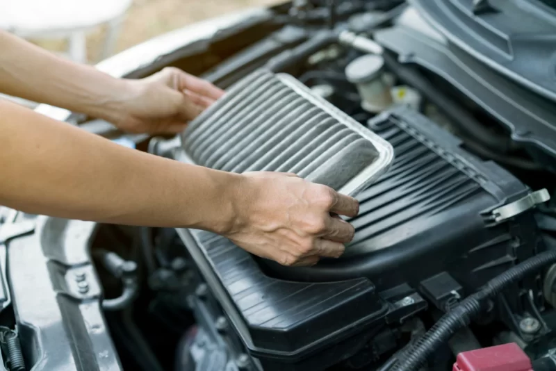 technician holding air filter