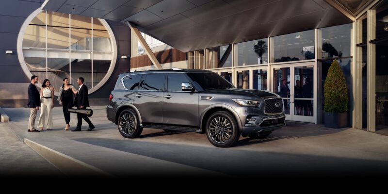 2022 infiniti qx80 suv grey parked front modern building